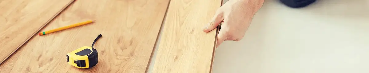 A professional installing wood flooring in Sacramento, CA