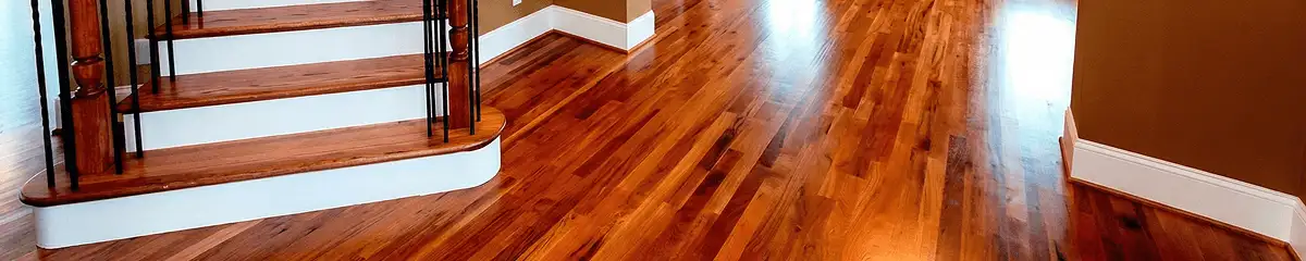 Base floor of a staircase with professionally restored wood flooring in Sacramento CA