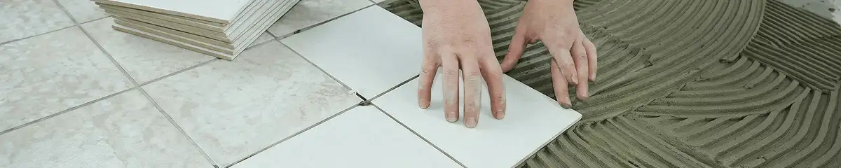Professional installing white tile floors in Sacramento, CA