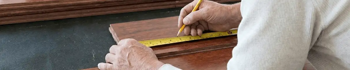 A professional installing wood flooring in Sacramento, CA